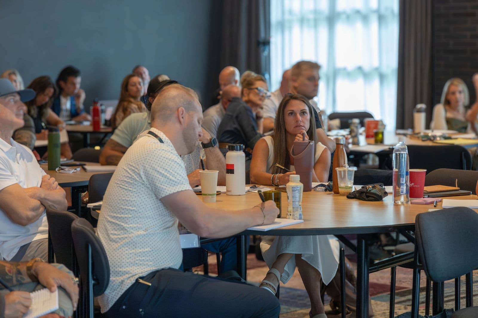 Attendees focused at tables