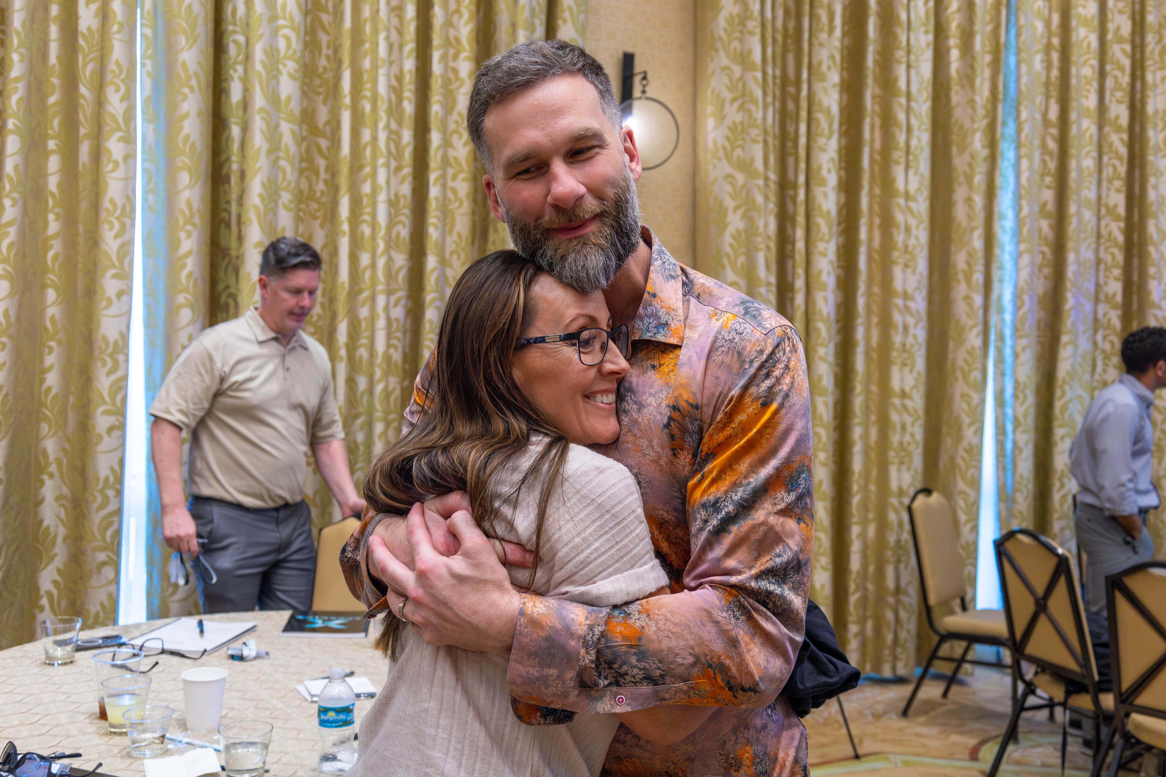 Warm embrace between attendees